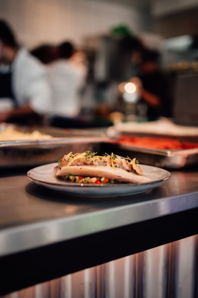 vertical-shot-serving-seafood-dish-restaurant-kitchen-table